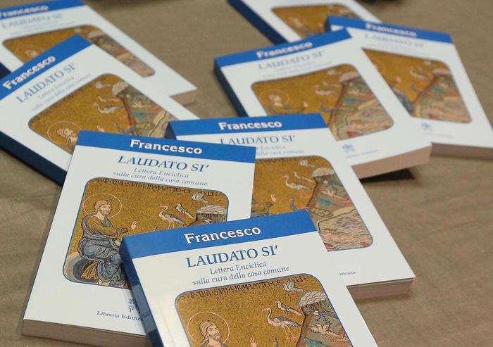 Copies of Pope Francis's encyclical, a collection of principles to guide Catholic teaching, entitled "Laudato Si " lies on a table during its official presentation at the Sinod hall in the Vatican, 18 June 2015.   ANSA/ALESSANDRO DI MEO